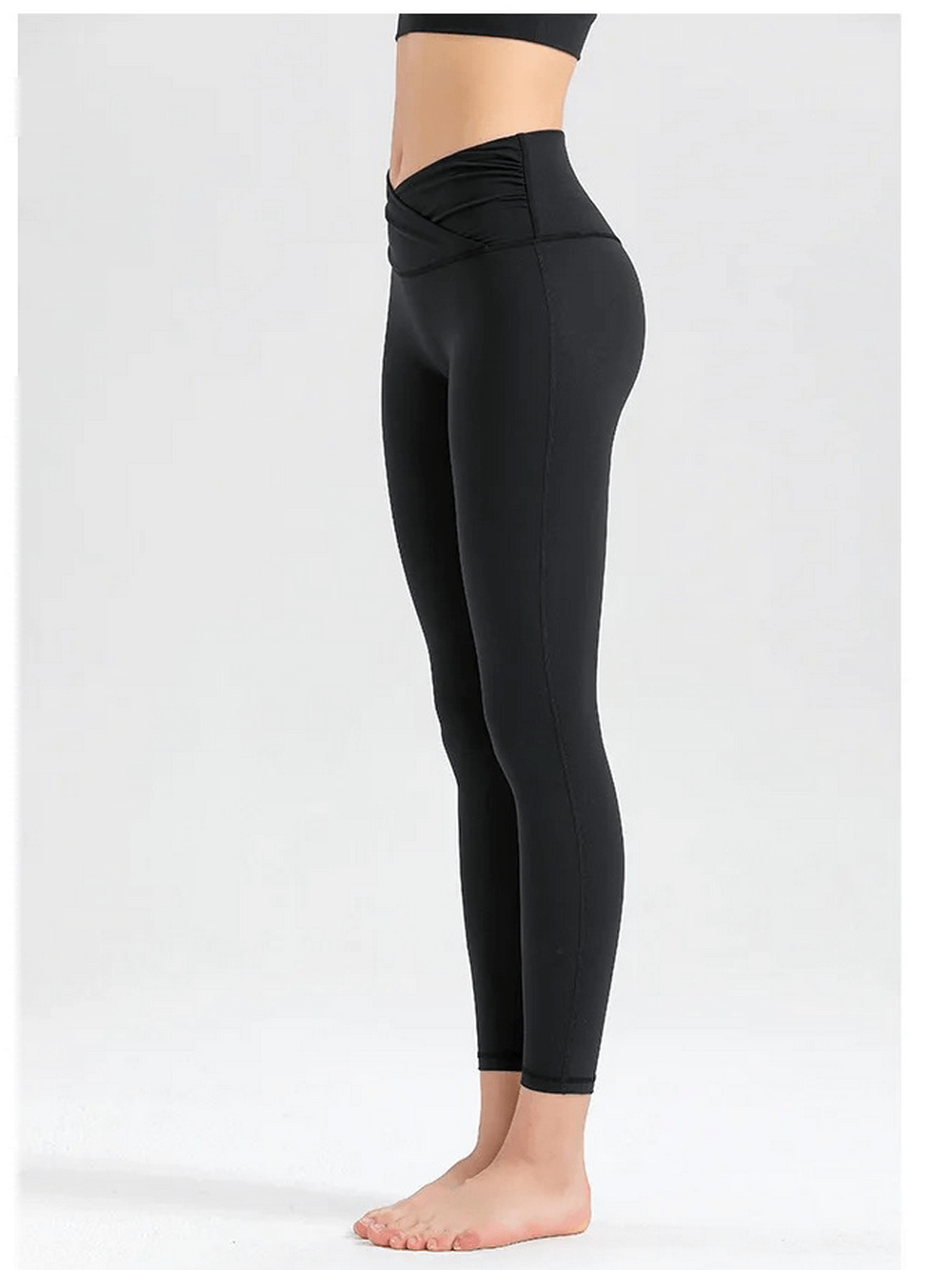 Side view of black women's spandex workout leggings, featuring a high waist and breathable fabric ideal for yoga or gym sessions.